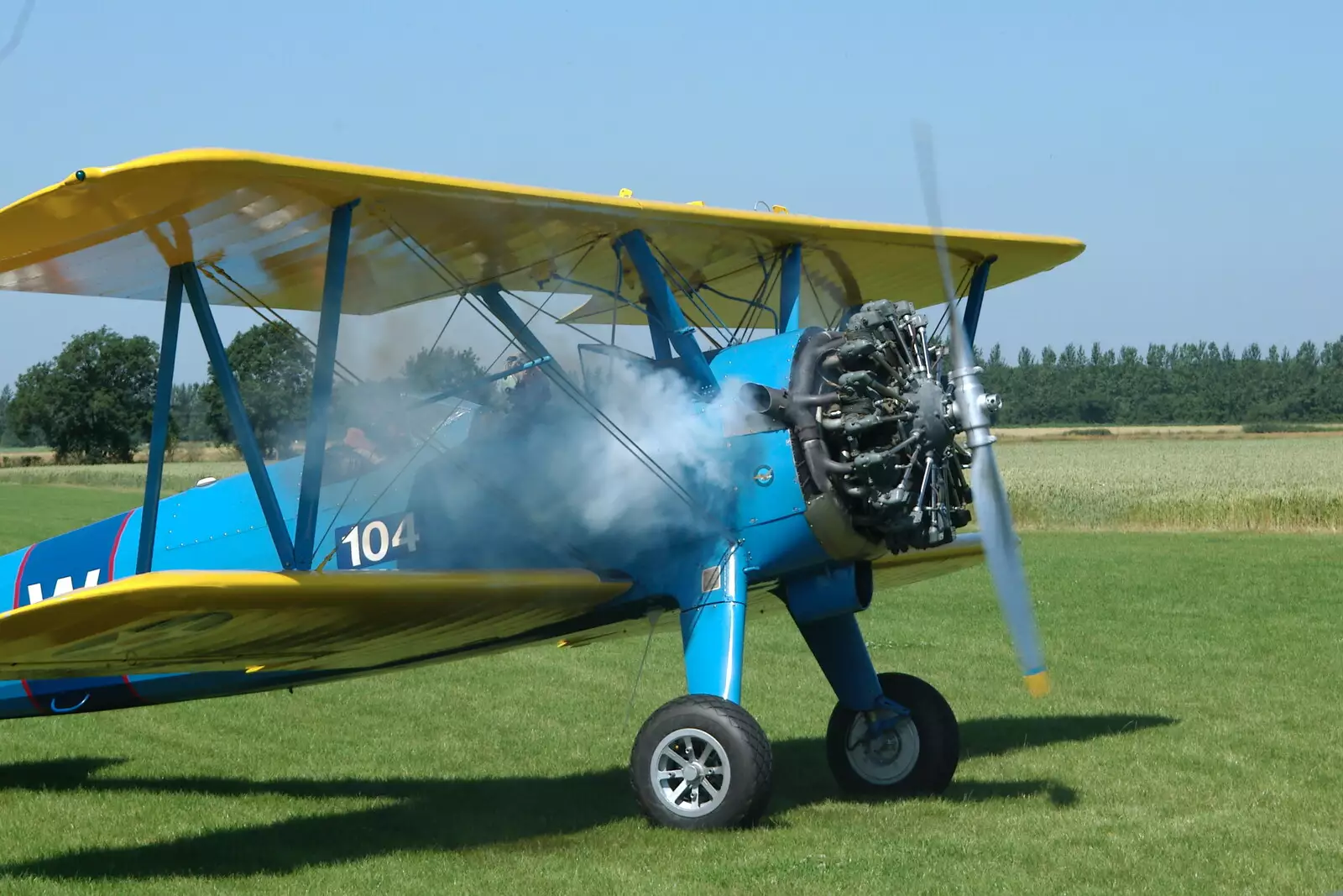 The 9-cylinnder radial fires up on the Stearman, from A Day With Janie the P-51D Mustang, Hardwick Airfield, Norfolk - 17th July 2005