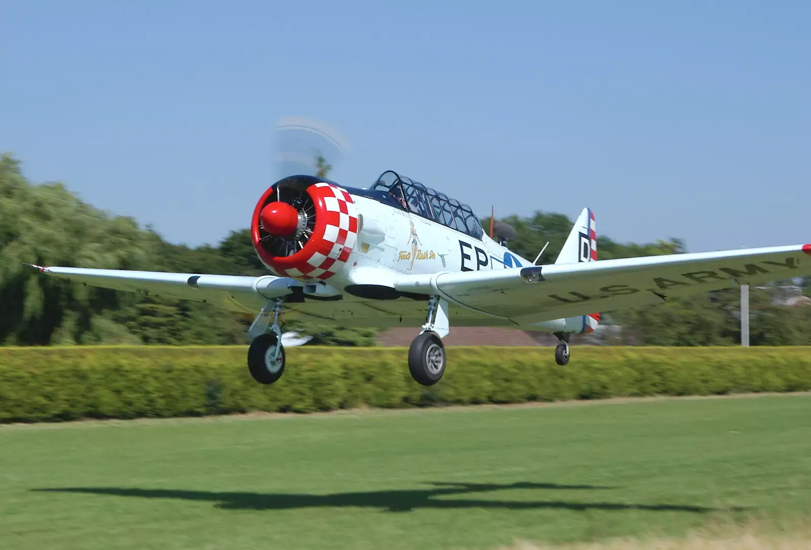 The Harvard takes off to do Thurston airshow, from A Day With Janie the P-51D Mustang, Hardwick Airfield, Norfolk - 17th July 2005