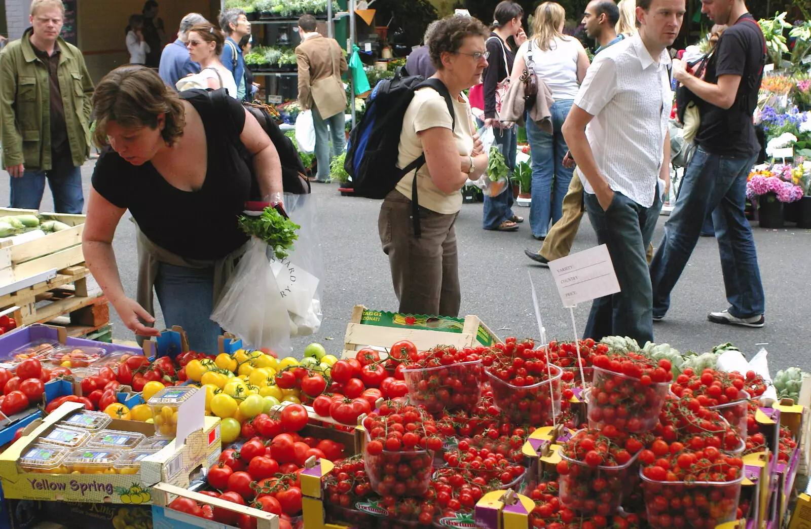 Sis browses tomatoes, from Borough Market and North Clapham Tapas, London - 23rd July 2005