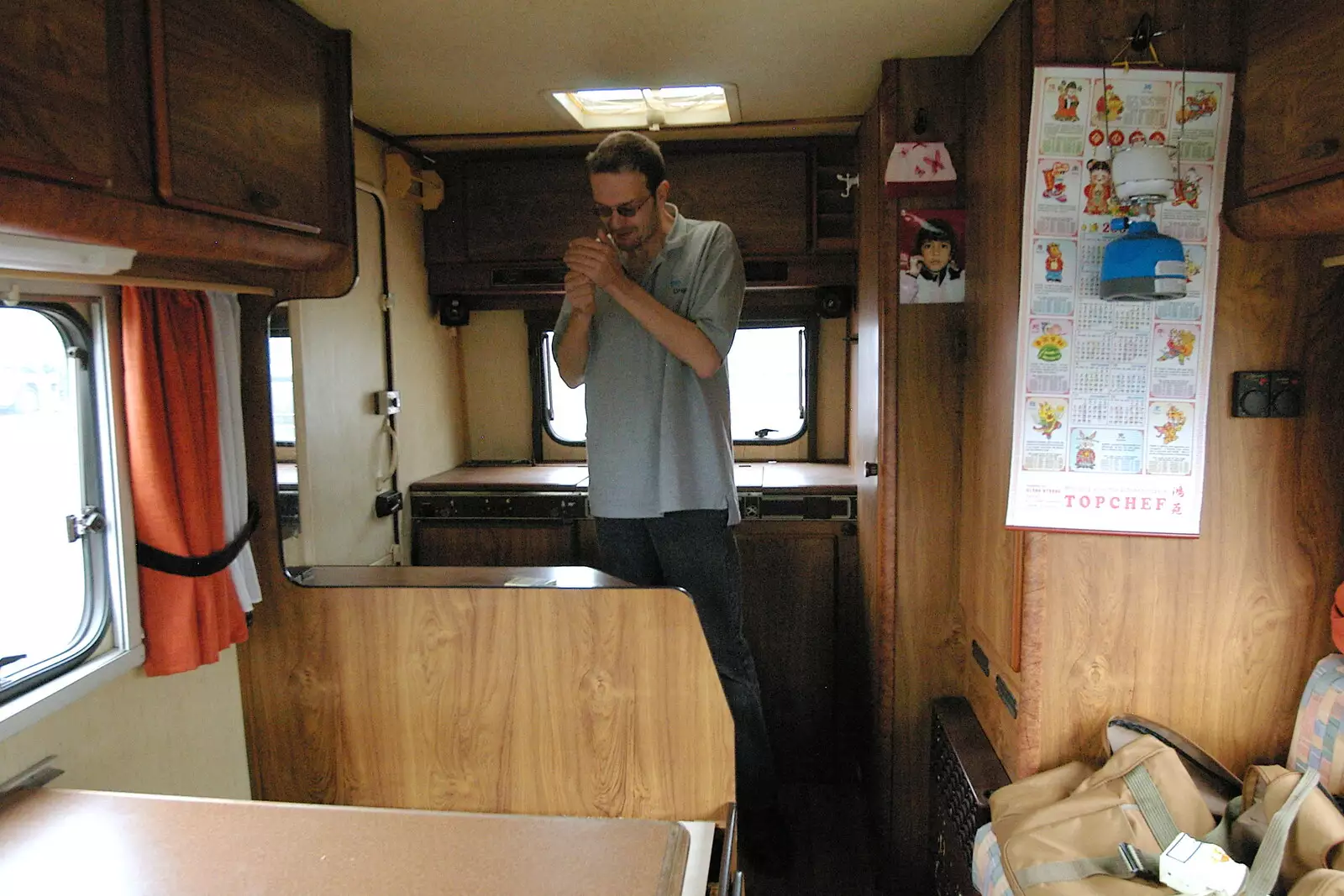 Richard lights up a fag in his new second home, from Richard Panton's Van and Alex Hill at Revolution Records, Diss and Cambridge - 29th July 2005