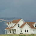 Dark skies amass behind a house on a hill, Route 78: A Drive Around the San Diego Mountains, California, US - 9th August 2005
