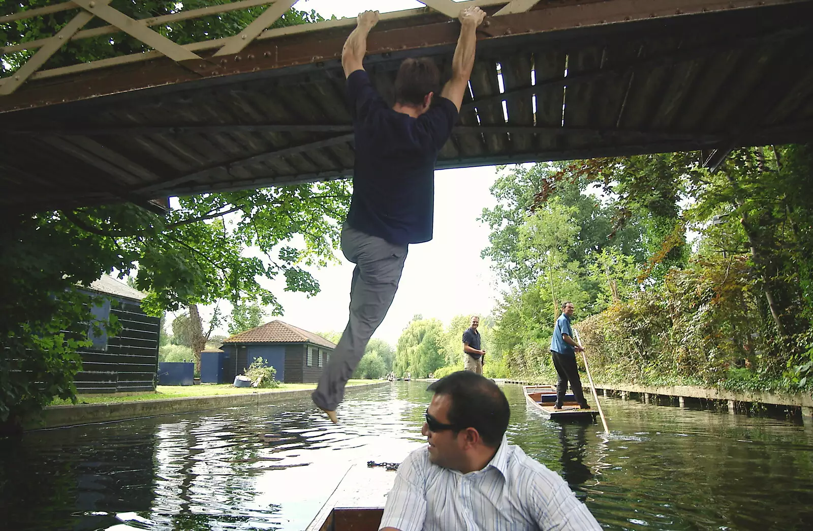 Ben leaps out of the punt to do the bridge-hop, from Qualcomm goes Punting on the Cam, Grantchester Meadows, Cambridge - 18th August 2005