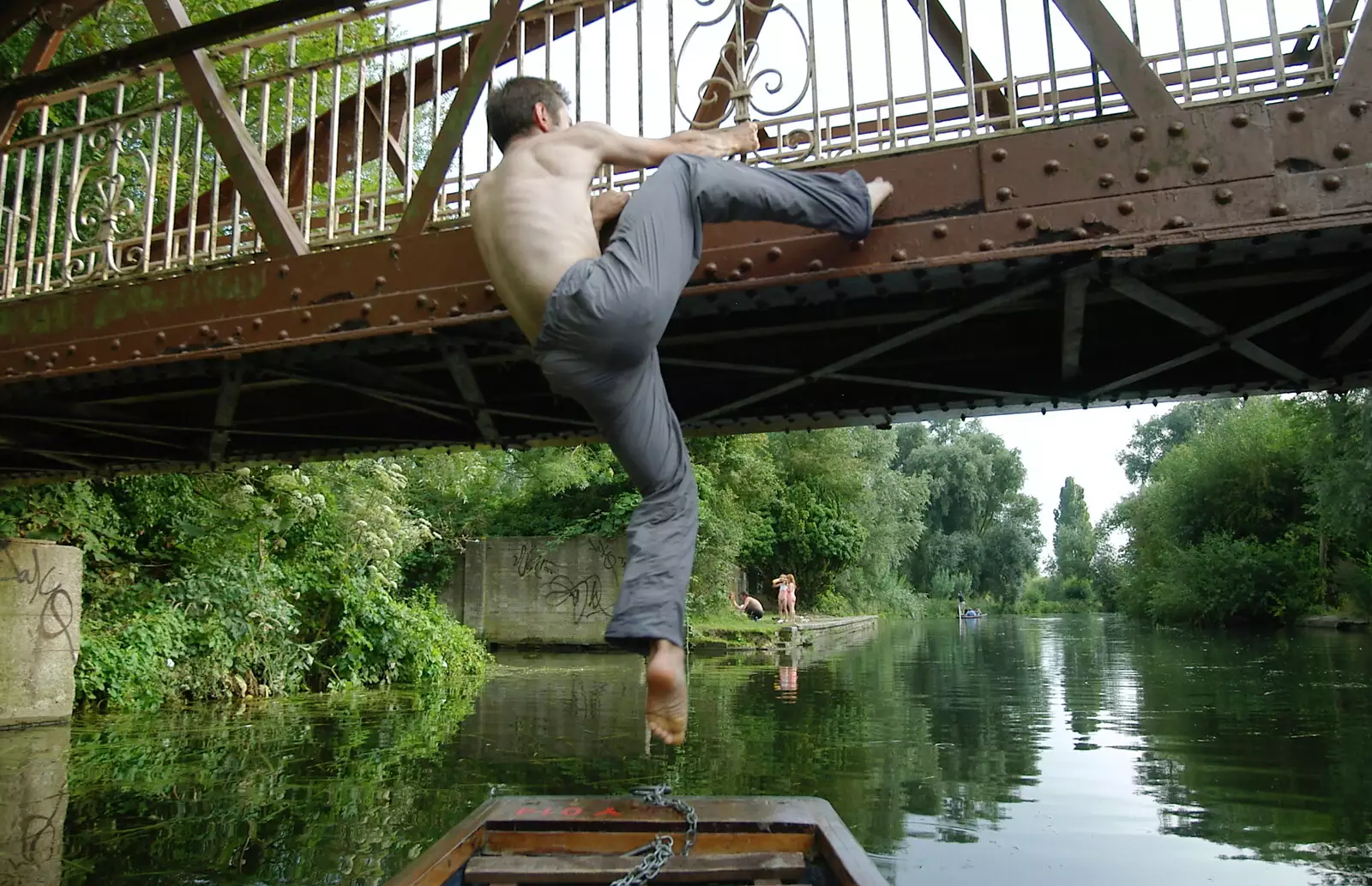 Ben hops another bridge, from Qualcomm goes Punting on the Cam, Grantchester Meadows, Cambridge - 18th August 2005