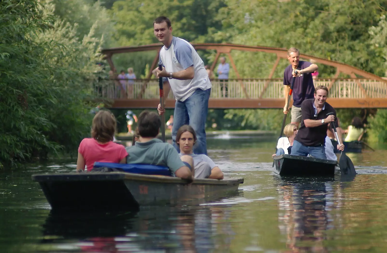 James and Tim in a slow-motion race, from Qualcomm goes Punting on the Cam, Grantchester Meadows, Cambridge - 18th August 2005