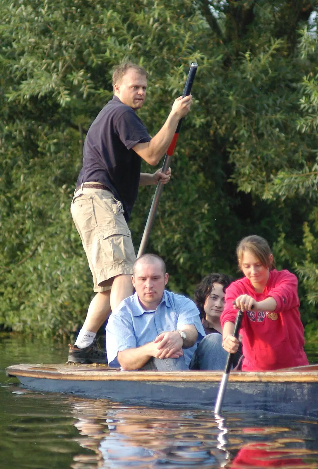 There's a look of concentration on Nick's face, from Qualcomm goes Punting on the Cam, Grantchester Meadows, Cambridge - 18th August 2005