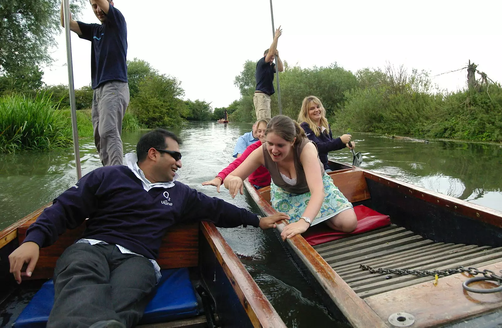 Anwar fends off Isobel's punt, from Qualcomm goes Punting on the Cam, Grantchester Meadows, Cambridge - 18th August 2005