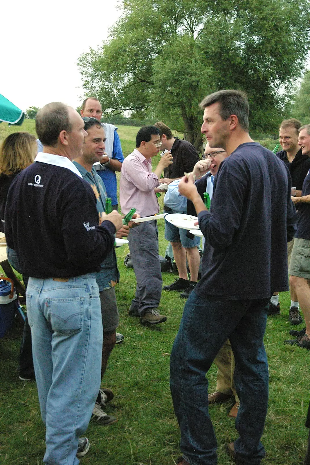 John chats to someone, from Qualcomm goes Punting on the Cam, Grantchester Meadows, Cambridge - 18th August 2005