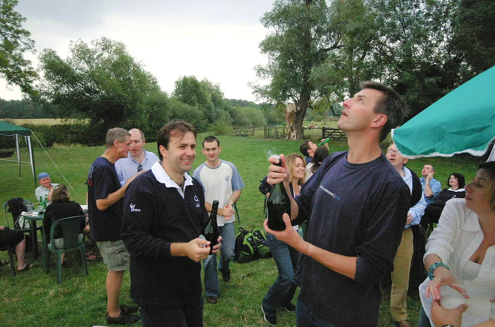 A champagne cork is popped, from Qualcomm goes Punting on the Cam, Grantchester Meadows, Cambridge - 18th August 2005