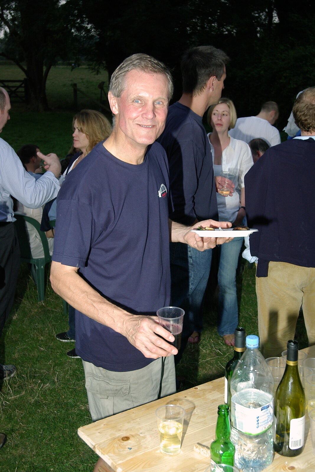 Tim Simpson with a glass of red wine from Qualcomm goes Punting on the Cam, Grantchester Meadows, Cambridge - 18th August 2005