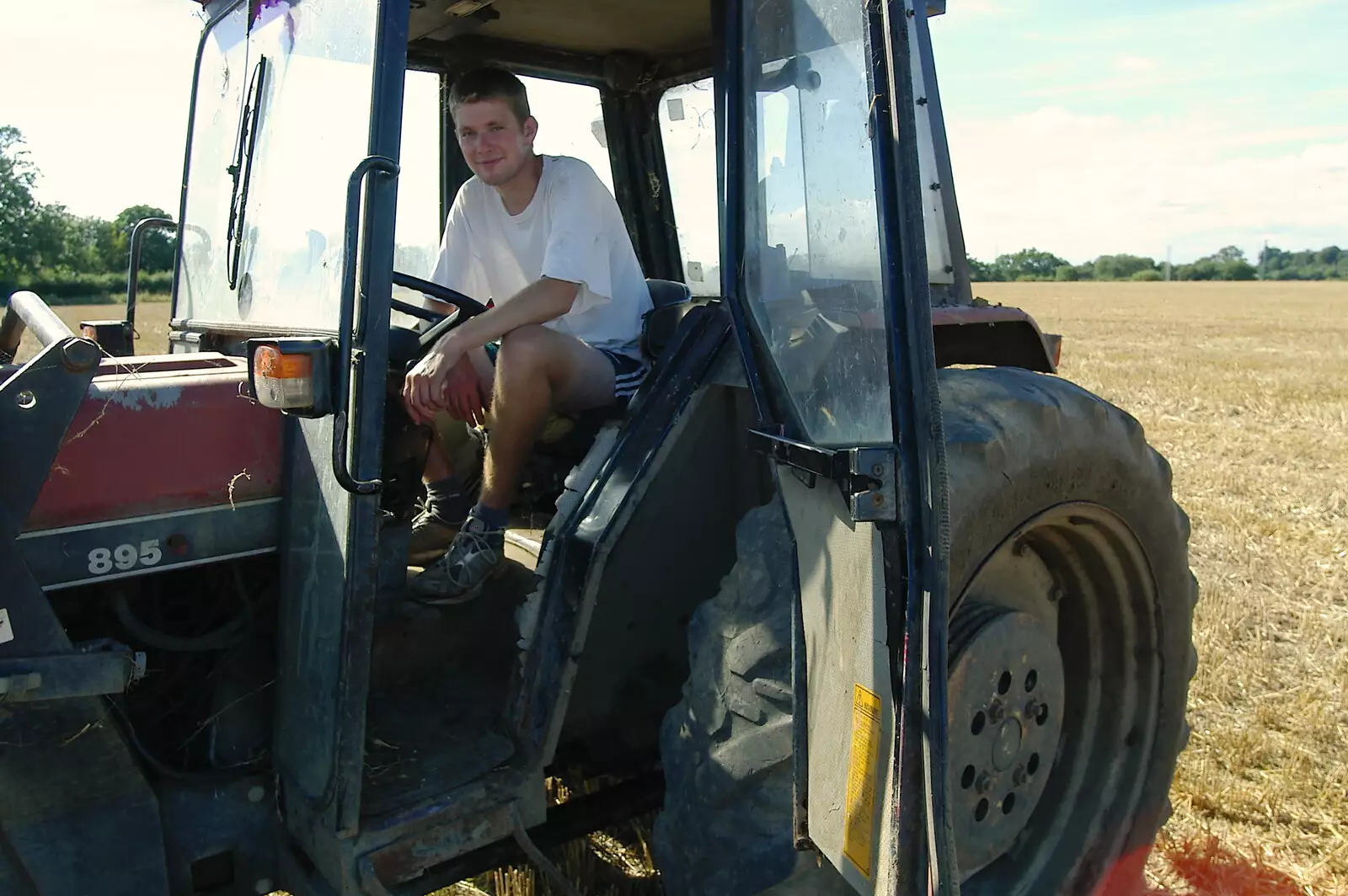 The Boy Phil is out in the tractor, from Life on the Neonatal Ward, Dairy Farm and Thrandeston Chapel, Suffolk - 26th August 2005