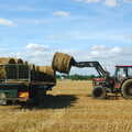 A bale is loaded onto a trailer, Life on the Neonatal Ward, Dairy Farm and Thrandeston Chapel, Suffolk - 26th August 2005