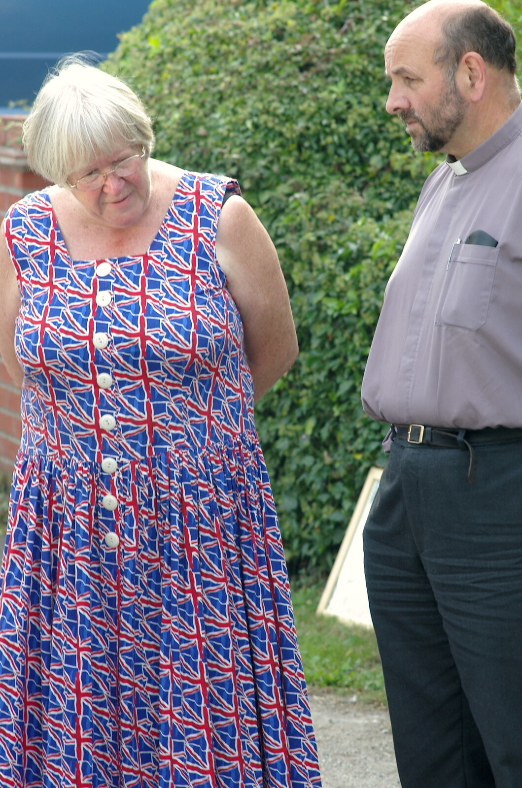 A woman in an appropriate dress talks to the vicar from Brome Village VE/VJ Celebrations, The Village Hall, Brome, Suffolk  - 4th September 2005