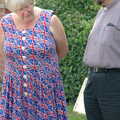 A woman in an appropriate dress talks to the vicar, Brome Village VE/VJ Celebrations, The Village Hall, Brome, Suffolk  - 4th September 2005