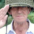 Alfie borrows Marc's combat helmet and salutes, Brome Village VE/VJ Celebrations, The Village Hall, Brome, Suffolk  - 4th September 2005