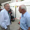 2005 Peter West, left, arrives, and chats to John Lummis
