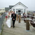 John escorts Sally along the pier, Sally and Paul's Wedding on the Pier, Southwold, Suffolk - 3rd September 2005