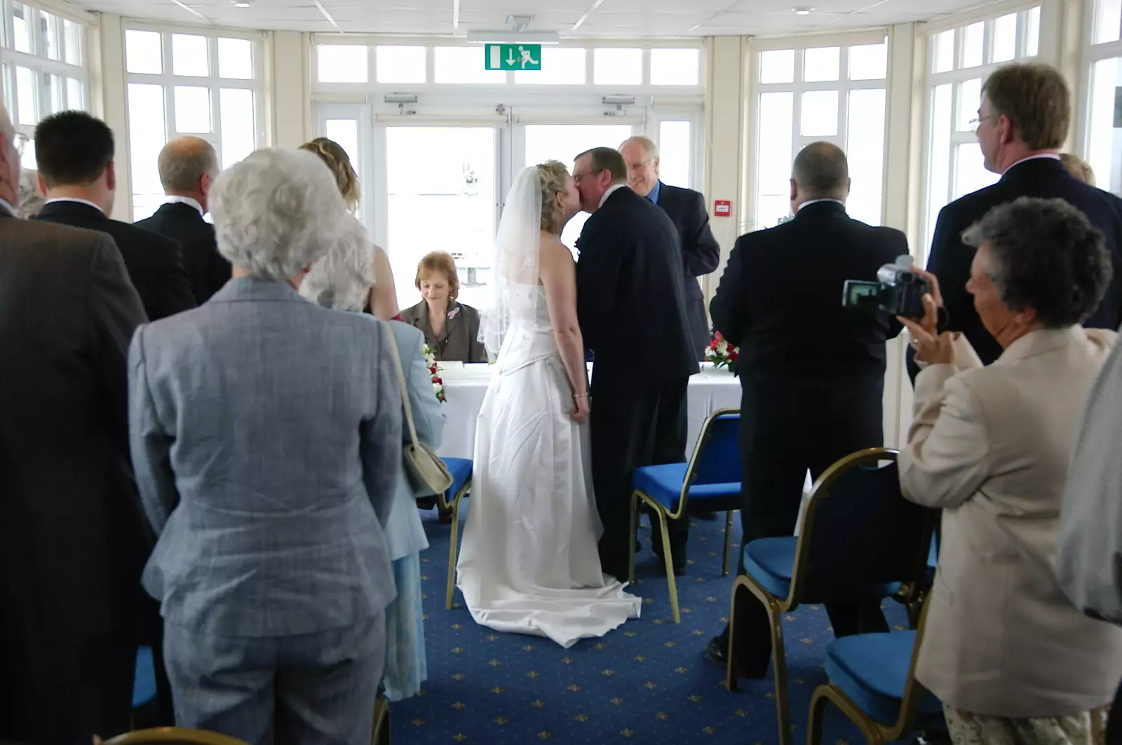 A snog after the service, from Sally and Paul's Wedding on the Pier, Southwold, Suffolk - 3rd September 2005