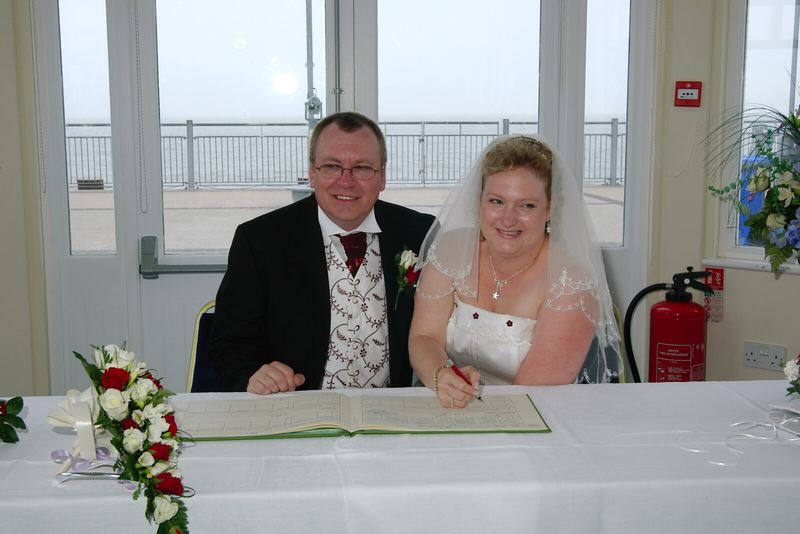 Paul and Sally do the fake signing thing from Sally and Paul's Wedding on the Pier, Southwold, Suffolk - 3rd September 2005