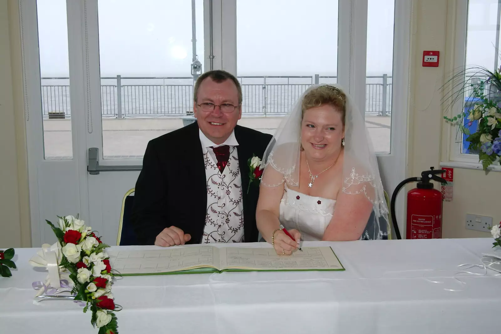 Paul and Sally do the fake signing thing, from Sally and Paul's Wedding on the Pier, Southwold, Suffolk - 3rd September 2005