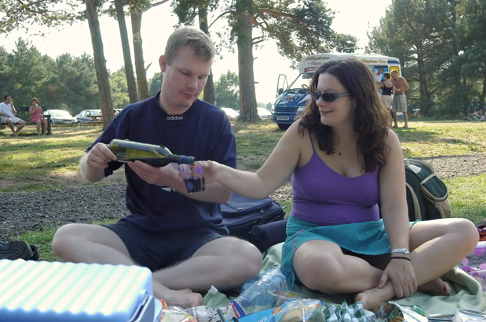 Mikey P pours Clare a bit of wine, from Picnic at the Heath, Knettishall, Norfolk - 4th September 2005