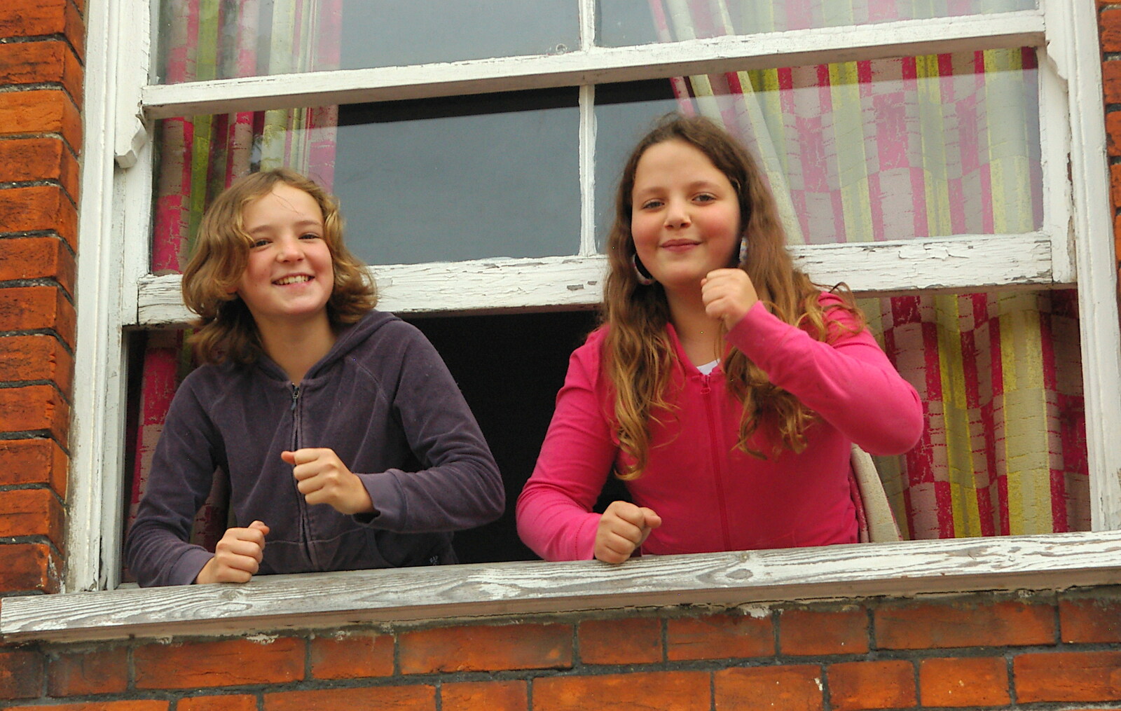 A couple of girls dance along from their window from Save Hartismere: a Hospital Closure Protest, Eye, Suffolk - 17th September 2005