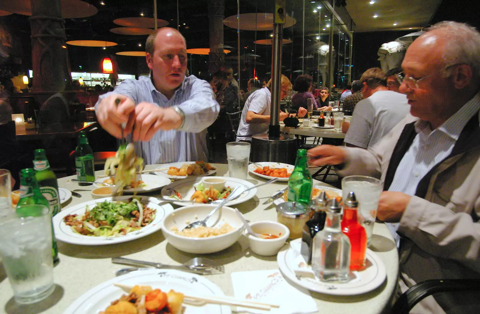 Russell grabs some food, from San Diego Four, California, US - 22nd September 2005