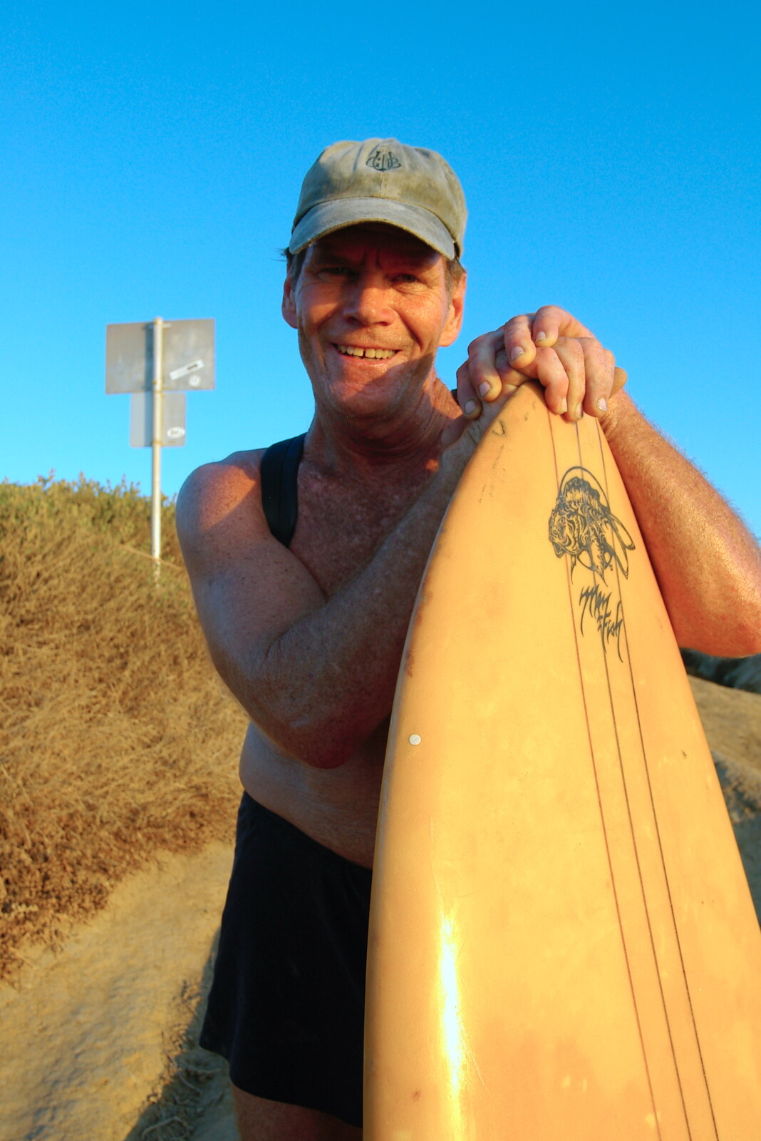 An old surfer dude with his board from San Diego Four, California, US - 22nd September 2005