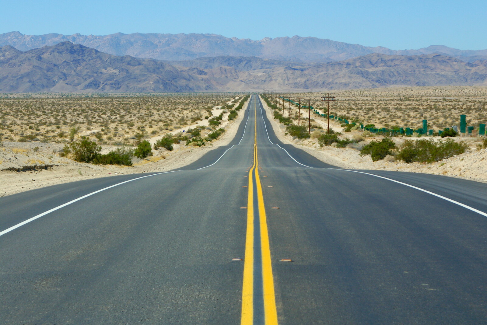 Classic vanishing-point view of Route 98 from California Desert: El Centro, Imperial Valley, California, US - 24th September 2005