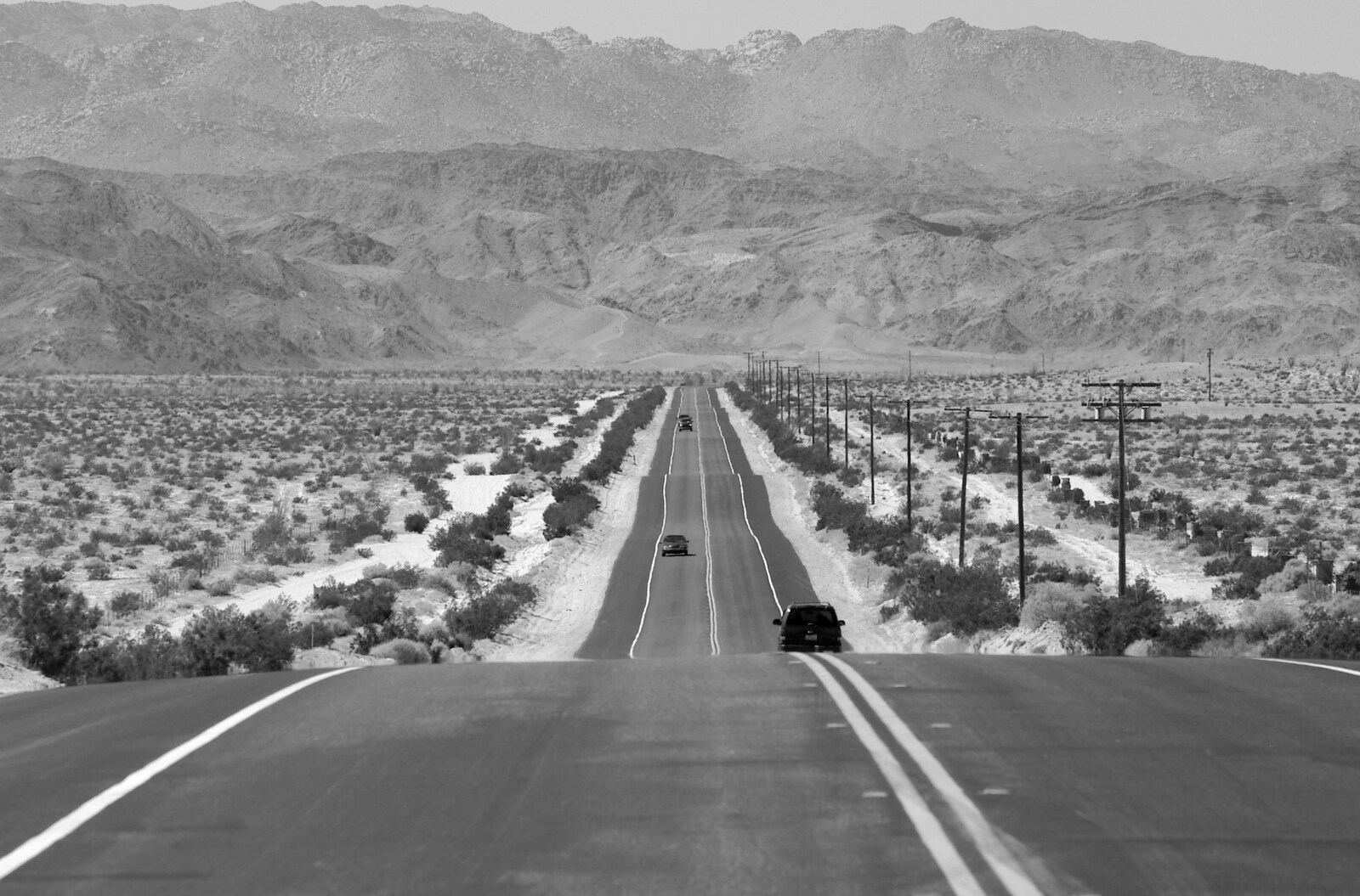 Cars on the ribbon of a highway from California Desert: El Centro, Imperial Valley, California, US - 24th September 2005