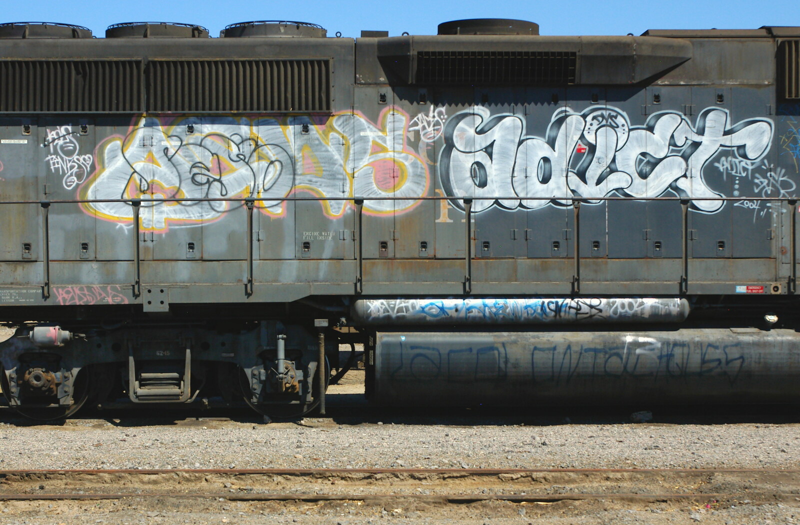 Graffiti tags on a locomotive from California Desert: El Centro, Imperial Valley, California, US - 24th September 2005