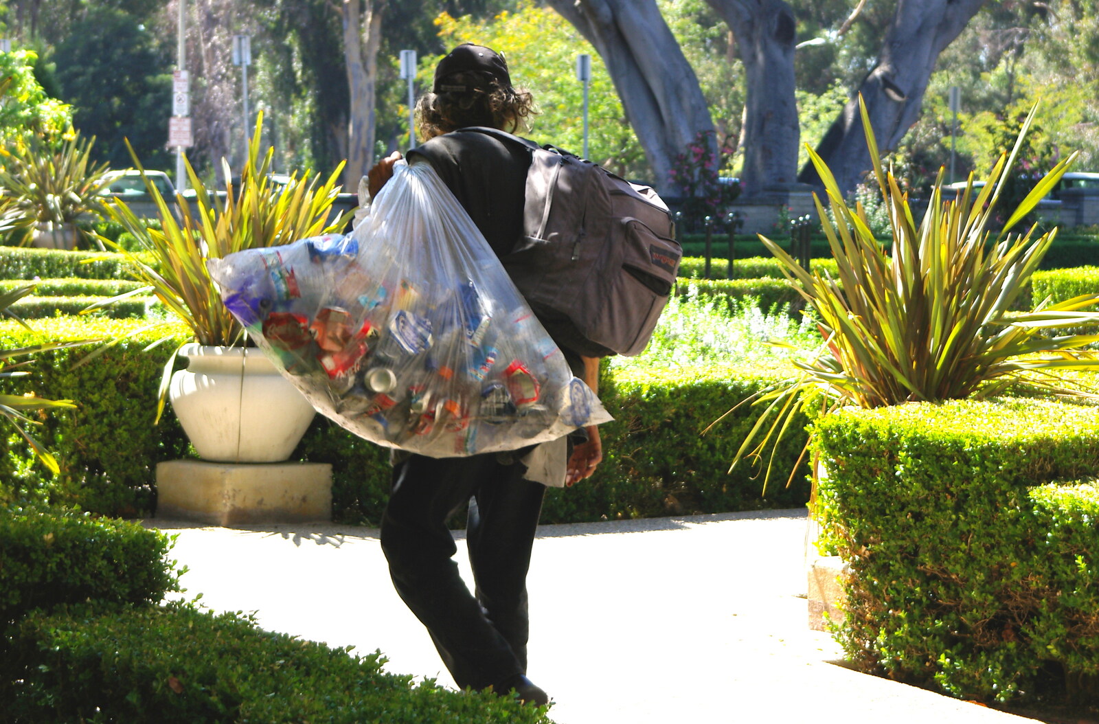Scenes and People of Balboa Park, San Diego, California - 25th September 2005: A dude with a big sack of cans