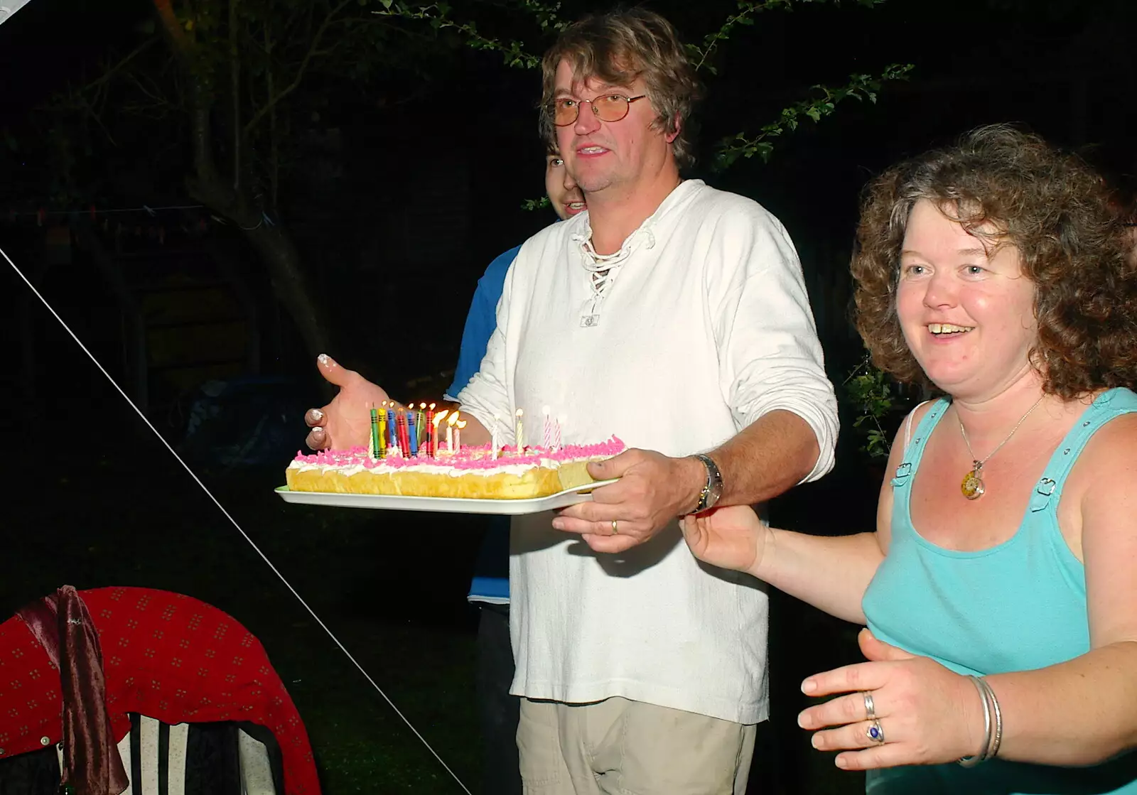 Steph's birthday cake is bought in by Martin, from Jo and Steph's Party, Burston, Norfolk - 30th September 2005