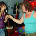 Jo hands back the mic, Jo and Steph's Party, Burston, Norfolk - 30th September 2005