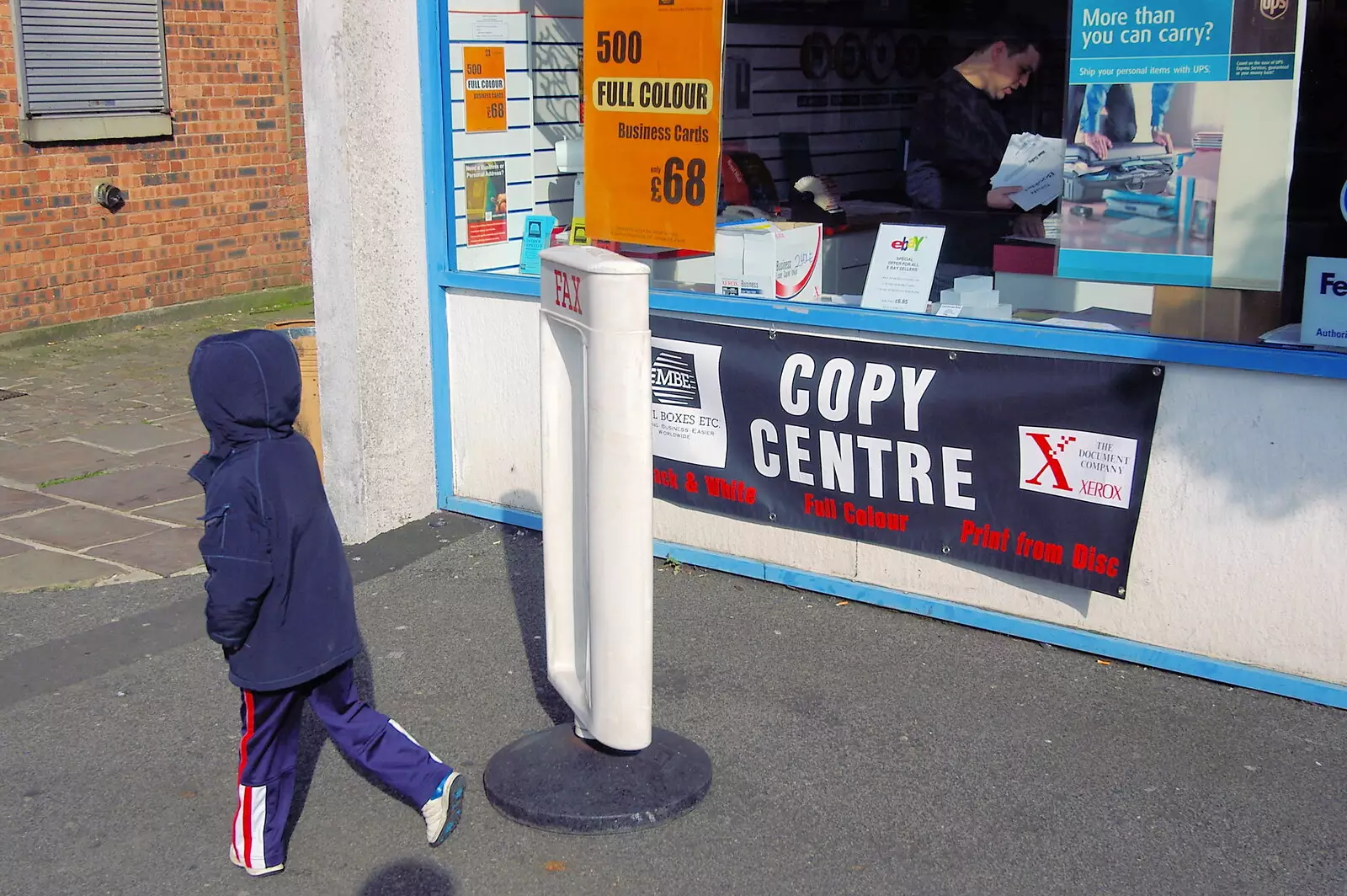 A kid spins a sign around, from A Trip Around Macclesfield and Sandbach, Cheshire - 10th September 2005