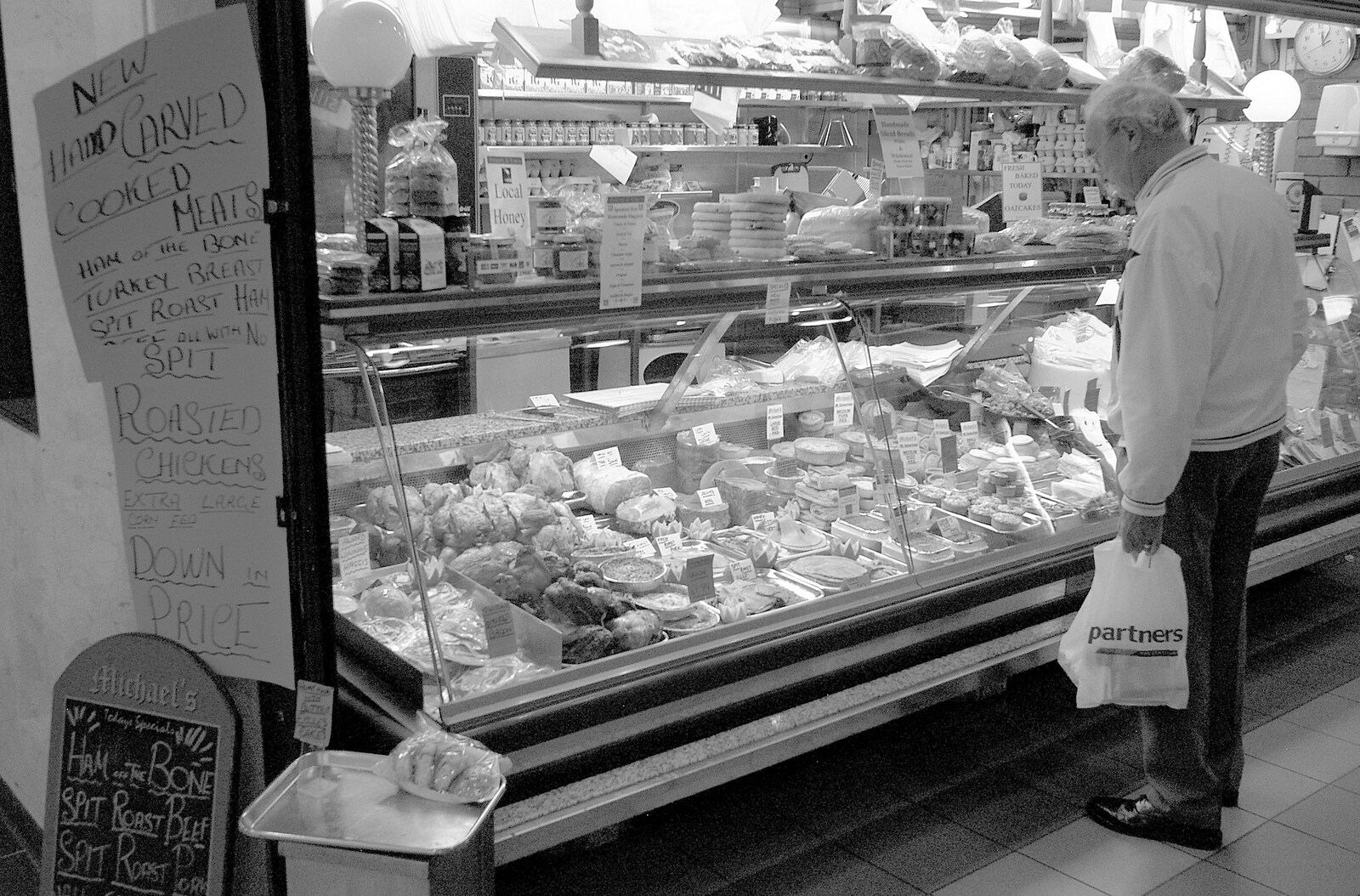 Some dude looks at a cold meats chiller from A Trip Around Macclesfield and Sandbach, Cheshire - 10th September 2005
