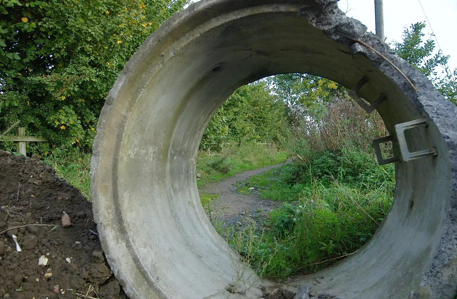 A concrete pipe is an 'anti-traveller' barrier, from Suffolk County Council Dereliction, and Cotton Flamenco, Suffolk - 22nd October 2005