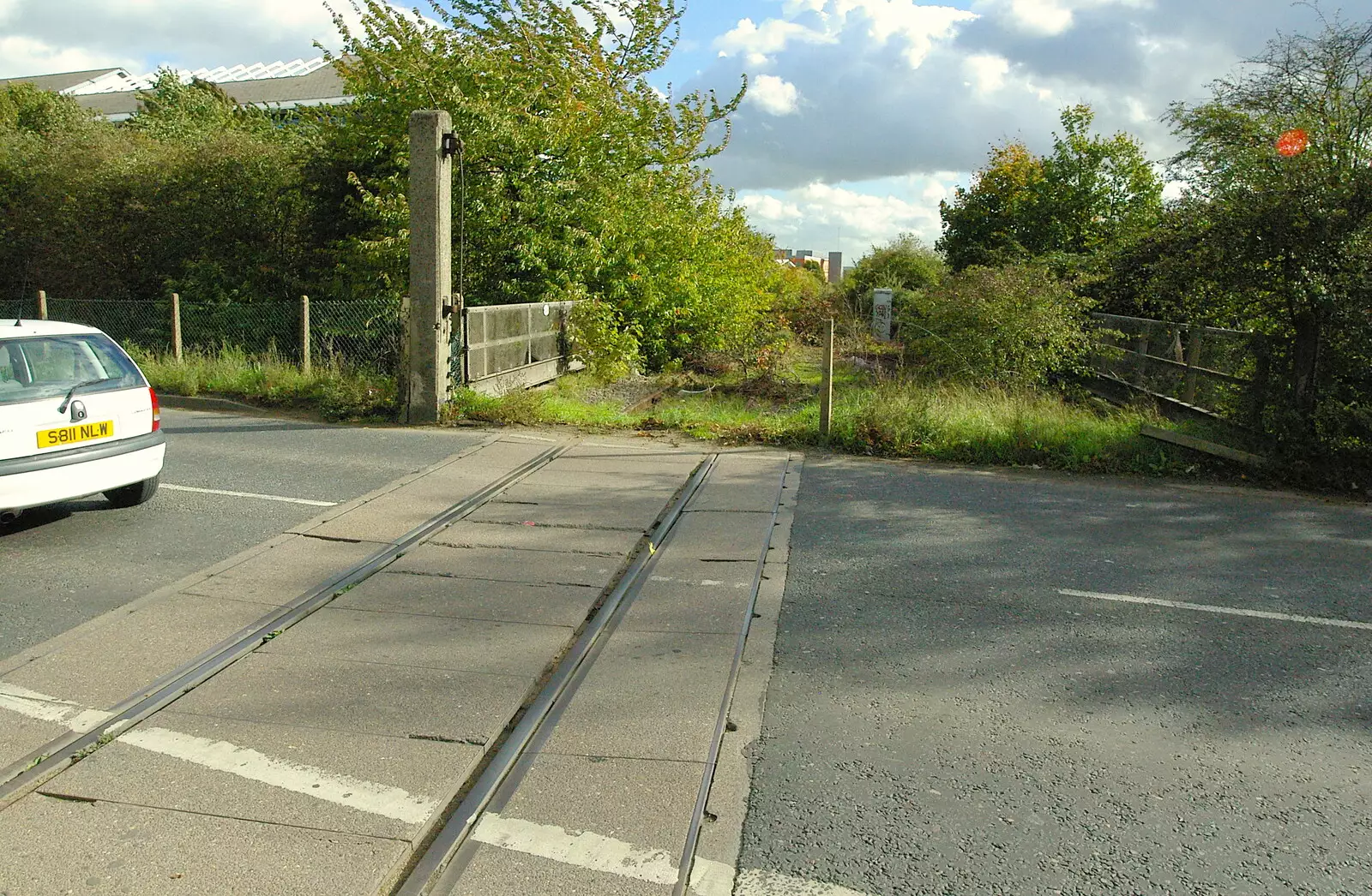 Where the tracks cross Milton Road, from Disused Cambridge Railway, Milton Road, Cambridge - 28th October 2005