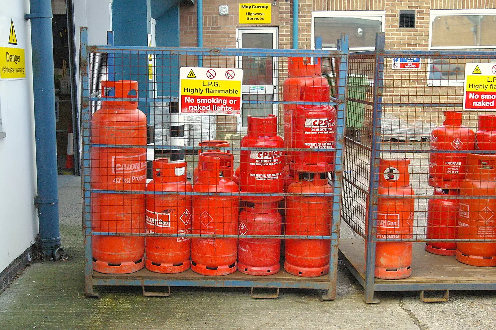 Bottles of gas in a cage. Mundane, but colourful, from Disused Cambridge Railway, Milton Road, Cambridge - 28th October 2005