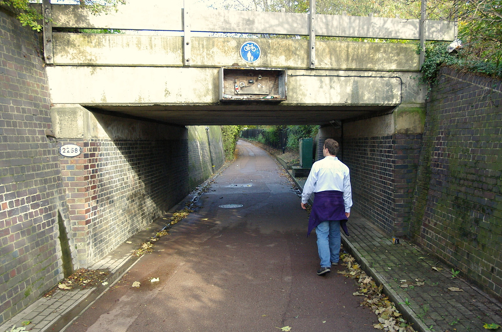 Dan walks through the underpass under the railway from Disused Cambridge Railway, Milton Road, Cambridge - 28th October 2005