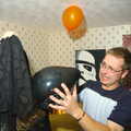 Marc gets to grips with a staticky balloon, Jen's Hallowe'en Party and Sazzle's Leaving Do, Mission Road, Diss - 28th October 2005