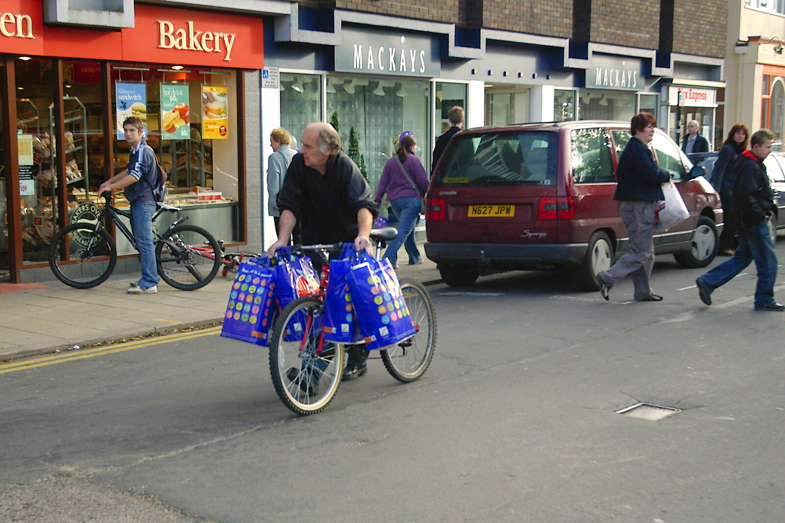 The weekly shop, dangling from a bike from Burnt-out Recycling Bins and Fireworks from a Distance, Diss, Norfolk - 4th November 2005