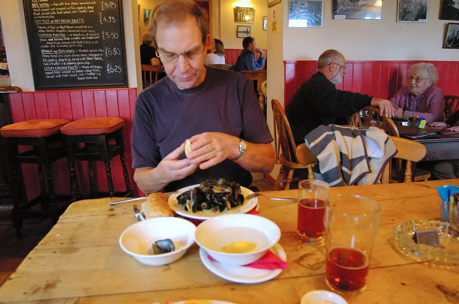 Mike eats a bowl of mussels, from Mother, Mike and the Stiffkey Light Shop, Cley and Holkham - 6th November 2005