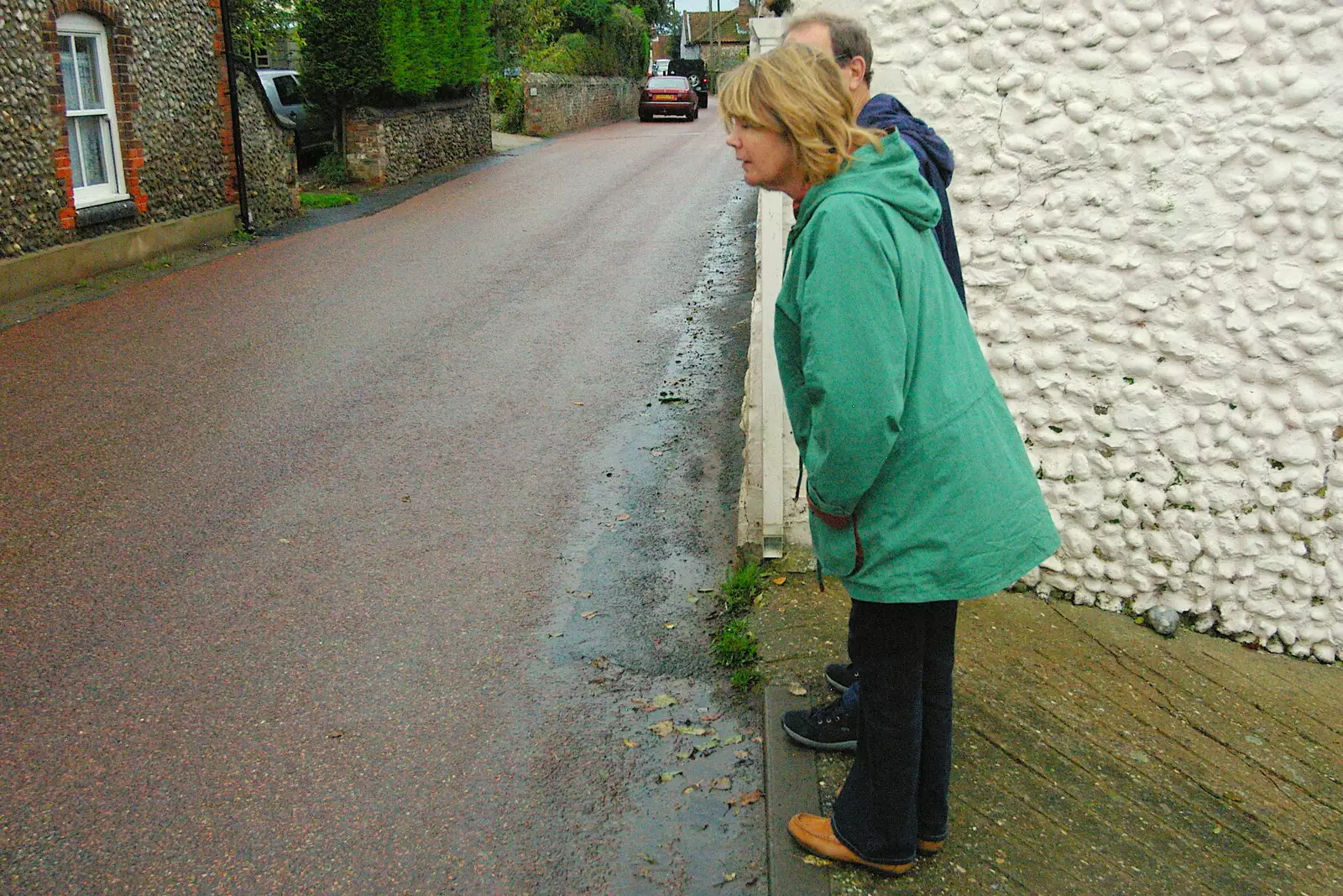 Mother peers into the street, from Mother, Mike and the Stiffkey Light Shop, Cley and Holkham - 6th November 2005