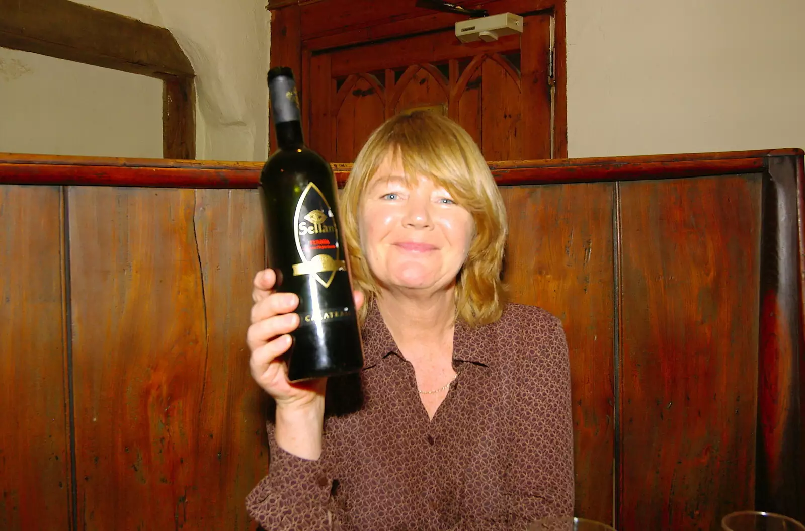 Mother holds up a bottle of Lebanese wine, from Mother, Mike and the Stiffkey Light Shop, Cley and Holkham - 6th November 2005