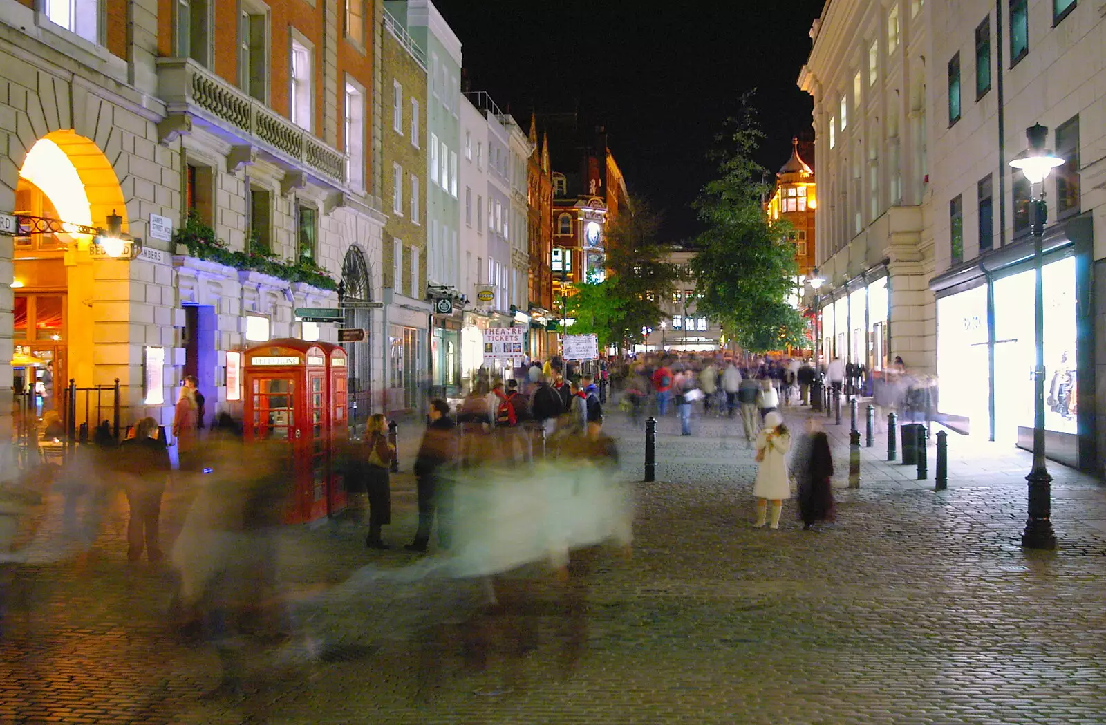 A couple of K6 phone boxes, as the crowds blur, from Qualcomm Europe All-Hands at the Berkeley Hotel, London - 9th November 2005