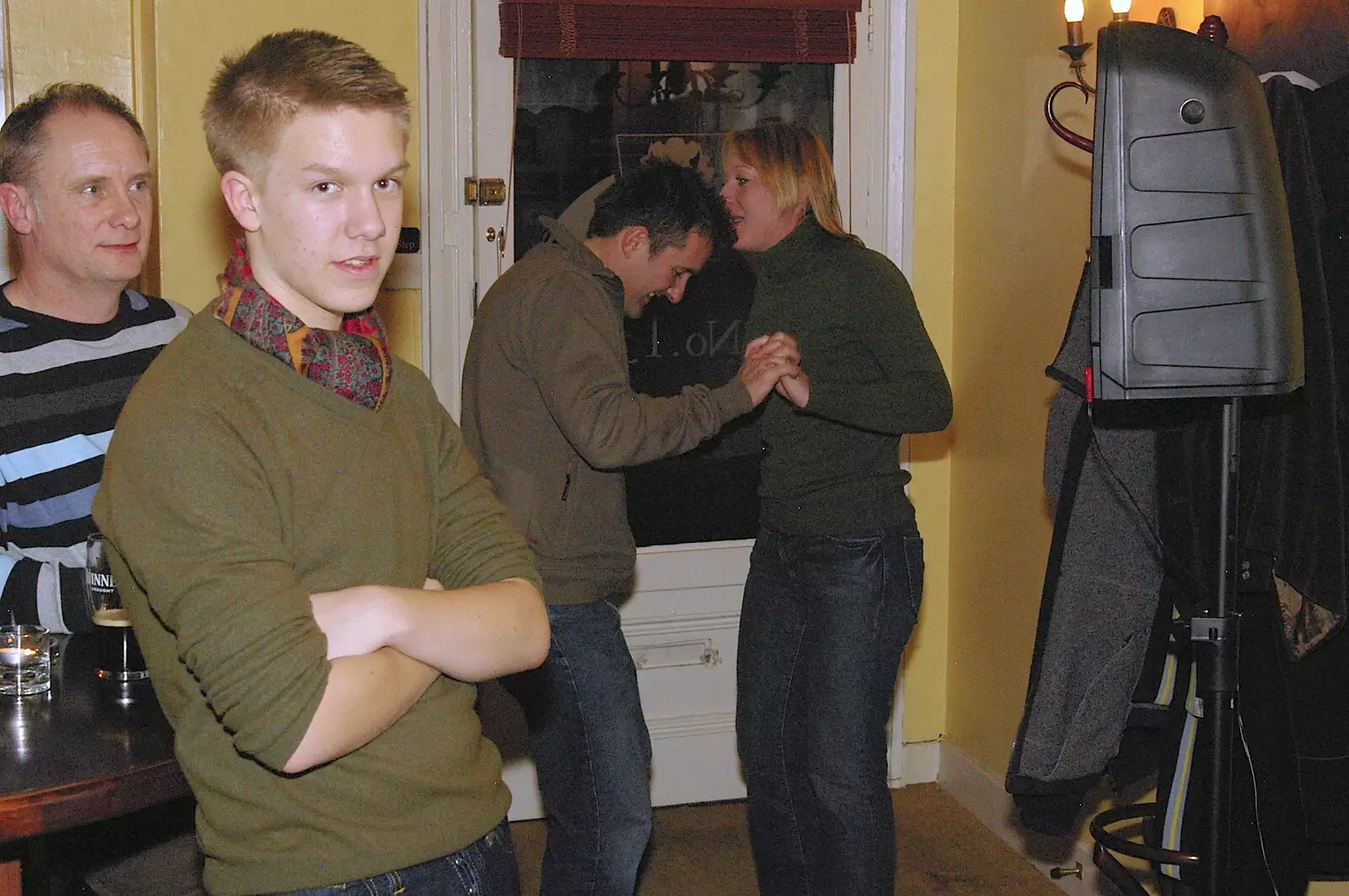 Rory Hill looks over as a couple dance by the door, from Most Haunted, and Music at Bar 13 and the Cherry Tree, Mellis - 26th November 2005