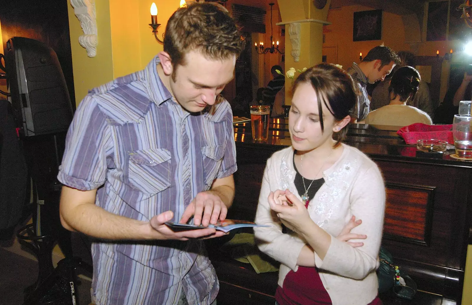 Warren checks a CD booklet, from Most Haunted, and Music at Bar 13 and the Cherry Tree, Mellis - 26th November 2005