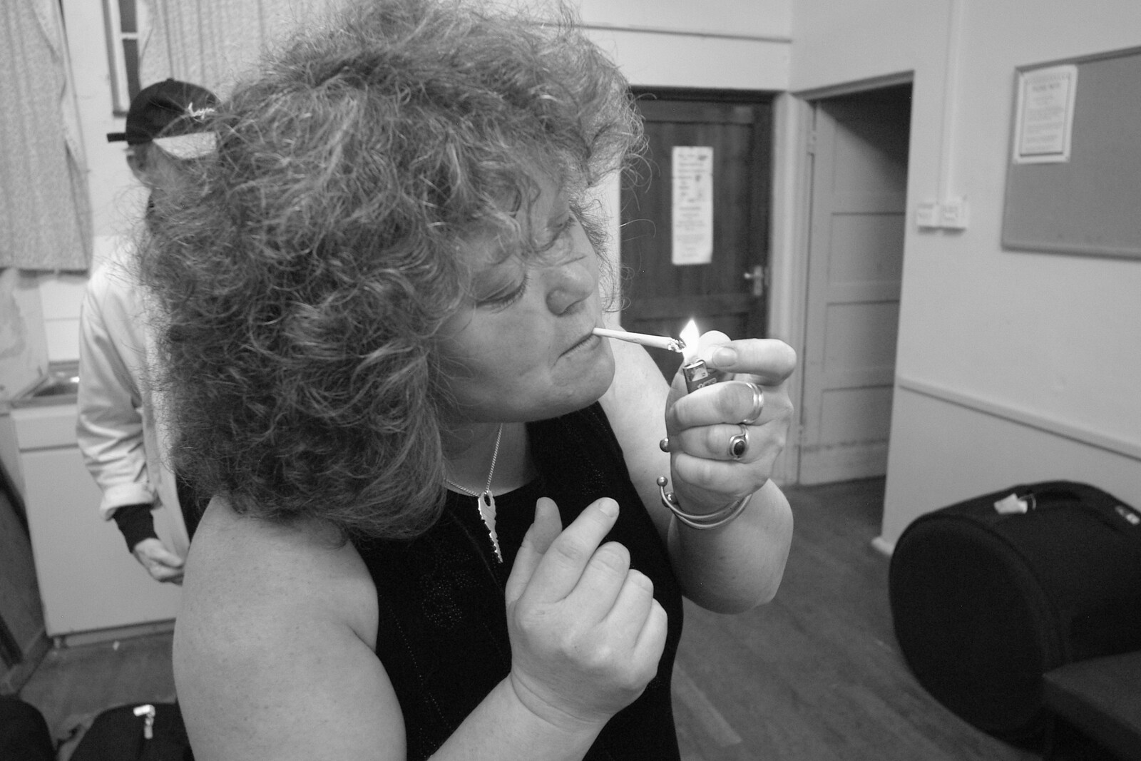 Jo lights her ciggie from The BBs' Rock'n'Roll Life, Kenninghall, Norfolk - 2nd December 2005