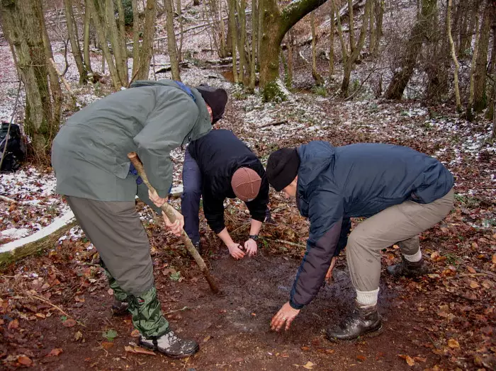 Nosher's group clear away all traces of our camp fire, from Walk Like a Shadow: A Day With Ray Mears, Ashdown Forest, East Sussex - 29th December 2005