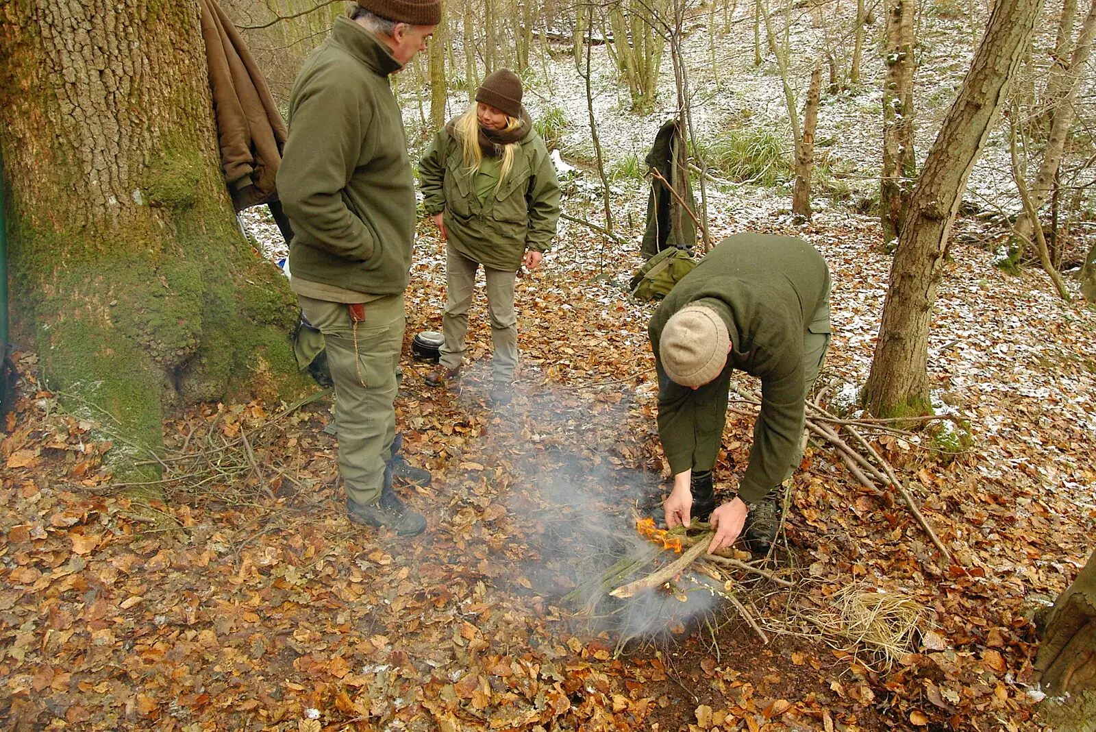 The Woodlore team's fire is going, from Walk Like a Shadow: A Day With Ray Mears, Ashdown Forest, East Sussex - 29th December 2005